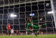 MADRID, SPAIN - FEBRUARY 13: David De Gea of Manchester United makes a save with his foot during the UEFA Champions League Round of 16 first leg match between Real Madrid and Manchester United at Estadio Santiago Bernabeu on February 13, 2013 in Madrid, Spain.